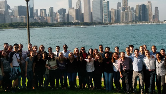 The current residents standing in front of the Chicago skyline
