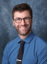A headshot of James McCluskey